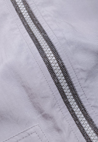 Close-up of light purple hoodie with double metallic zipper track at the center front