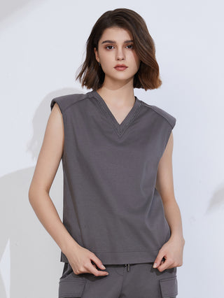 Dark gray V-neck tank top with side ties and patch pockets at hem