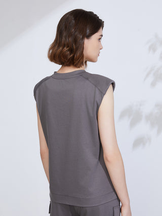 Dark gray V-neck tank top back view with draped seam and cap sleeves