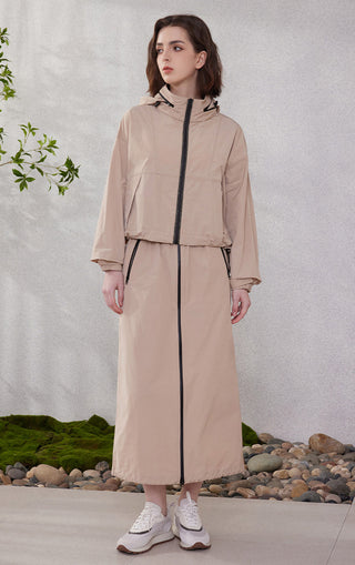 Camel hooded windbreaker jacket with long sleeves, black zipper, and drawcord hem