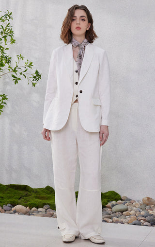 White linen relaxed straight-leg pants with roomy leg and stitched panel at sides