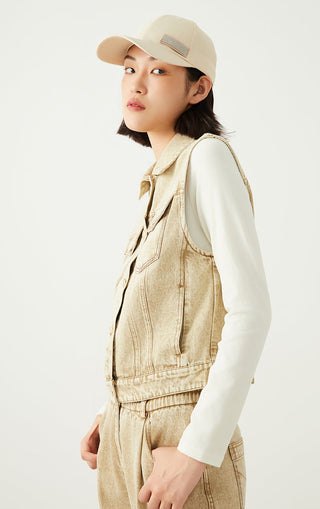 Light tan denim sleeveless jacket with button front and double chest pockets