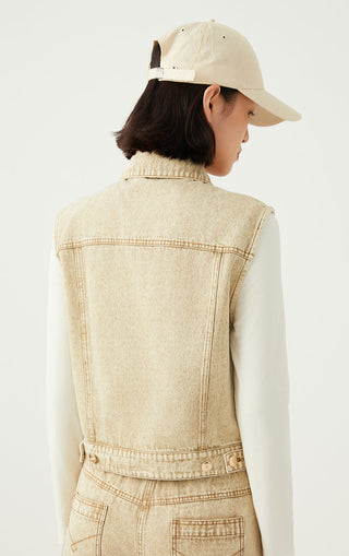 Back view light tan denim sleeveless jacket with yoke seam and waistband detail