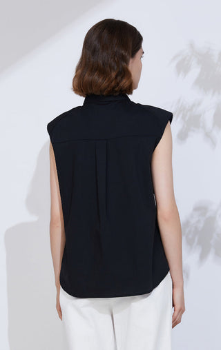 Back view of black sleeveless button-up shirt with center seam and yoke