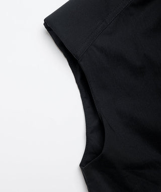 Black sleeveless shirt close-up of armhole and side curve seam.