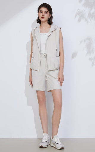 Light gray tailored shorts with elastic waist and flap-style front pockets