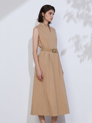 Khaki sleeveless V-neck maxi dress with tan belt and relaxed draped skirt