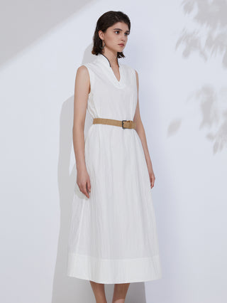 White cotton sleeveless V-neck maxi dress with tan woven belt and full gathered skirt