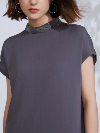 Embroidered necklace-style collar on dark gray silk shift dress with short sleeves