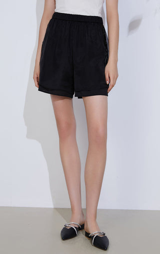Black sheer-layered lightweight shorts, elastic waistband and layered hem