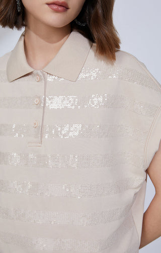 Camel sequin-striped polo knit top close-up: pointed collar and button placket