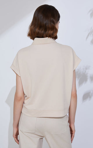 Camel sequin-striped polo knit top back view, collar and curved hem visible