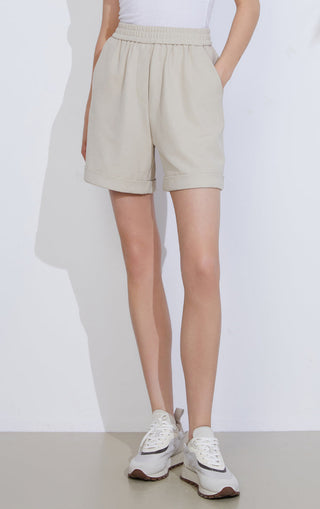 Khaki relaxed cotton knit shorts with elastic waistband and side pockets, above knee