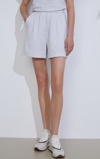 Light gray combed cotton relaxed shorts with gathered elastic waist, above-knee