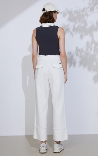 Back view of black sleeveless polo with white collar trim and button placket