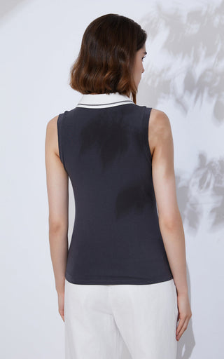 Back of black sleeveless polo with white collar trim and visible side seams