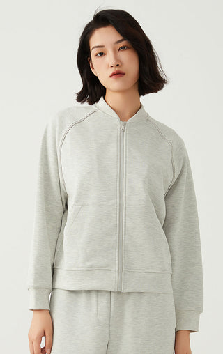 Light gray zip-up jacket with stand collar and front zipper with side pockets.