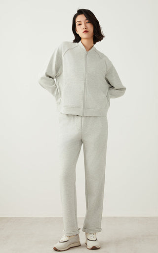 Light gray zip-up jacket with front zipper and matching jogger-style pants.