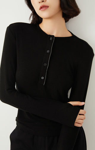 Black henley neckline with button placket and long sleeves