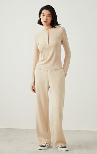 Apricot Tencel wool henley long-sleeve top with straight hem and button placket.