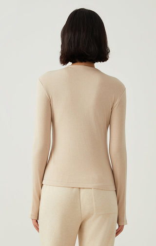 Apricot henley long-sleeve top, back view with clean neckline and straight hem.