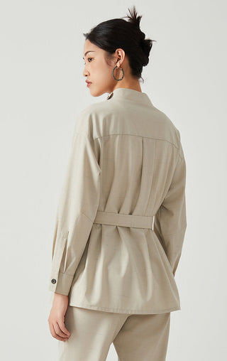 Beige belted jacket back view, long sleeves, buttoned stand collar