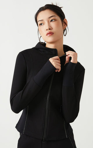 Black zip-front hoodie with hood; hands near zipper pull detail on chest