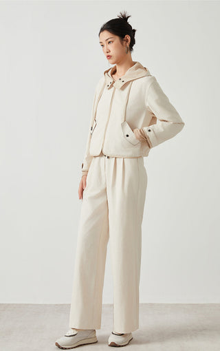 Beige hooded short jacket with long sleeves, front snaps, and drawstring hem