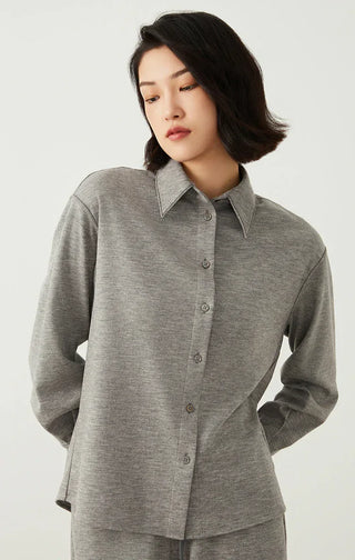 Light gray button-up overshirt with pointed collar and long sleeves, curved hem