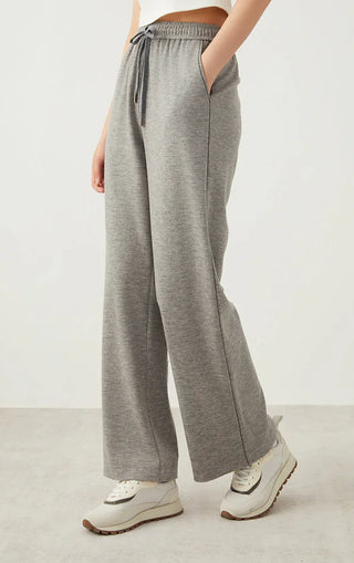 Light gray wide-leg pants, side view; drawstring elastic waist and relaxed drape