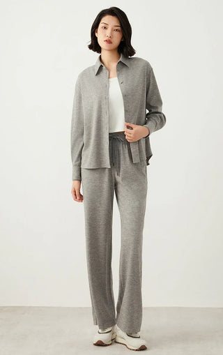 Light gray wide-leg pants with elastic waistband and drawstring; full-length relaxed fit