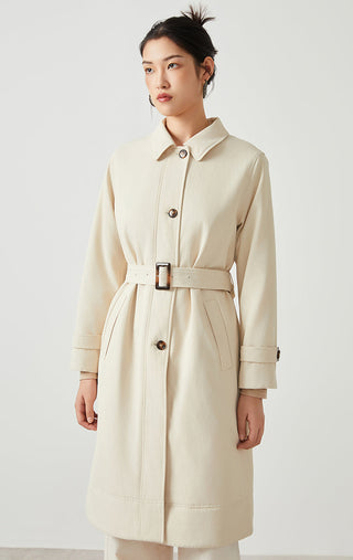Front view camel belted coat with stand collar, long sleeves, and dark buttons