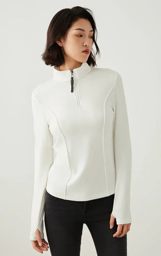 White half-zip knit top with high collar and beaded zipper pull, long sleeves