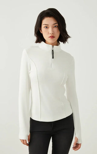 White half-zip knit top with beaded zipper pull and long sleeves, straight-on view