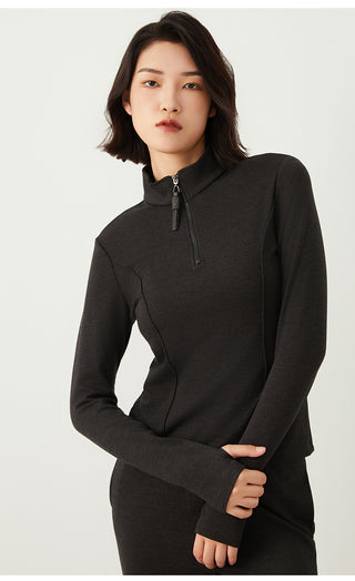 Dark gray half-zip knit top with beaded pull tab at center front, long sleeves