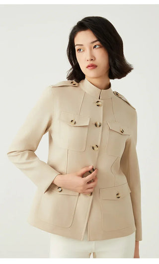 Camel utility jacket close-up look: button placket, flap pockets, and shoulder tab detail