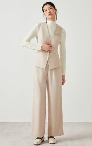 Camel wool-blend vest with V-neck, button front, patch pockets; styled with matching trousers