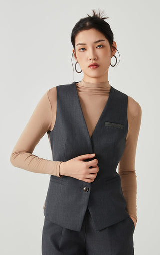 Dark gray tailored wool-blend vest, V-neckline, button front and chest beaded label