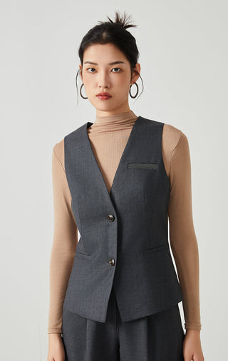 Dark gray wool-blend tailored vest with V-neck, button front, patch pockets, beaded label