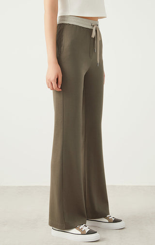 Army green wide-leg drawstring pants, side view with relaxed, straight legs