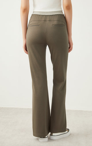 Army green wide-leg pants, back view with elastic drawstring waist and patch pockets