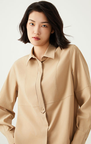Close view of khaki structured shirt: pointed collar and center button placket
