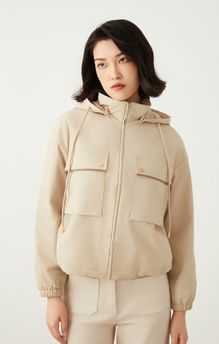 Apricot hooded utility jacket with cargo-style flap pockets and elastic cuffs