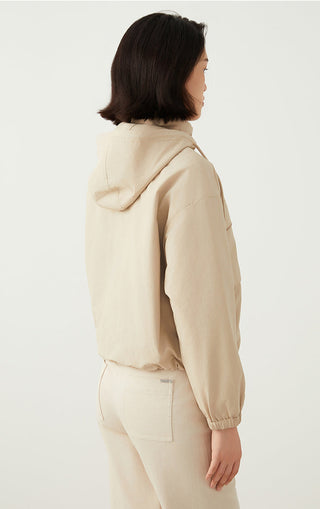 Apricot hooded utility jacket back view, adjustable hood ties and rear pocket