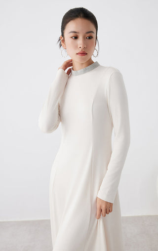White long-sleeve midi dress with high collar and smooth front panel