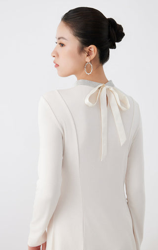 White long-sleeve midi dress back view with neck tie ribbon detail