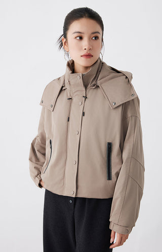 Dark khaki oversized hooded puffer jacket with snap placket and flap pockets