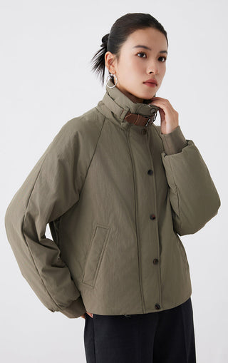 Army green utility jacket with stand collar and leather strap detail, button front, side view