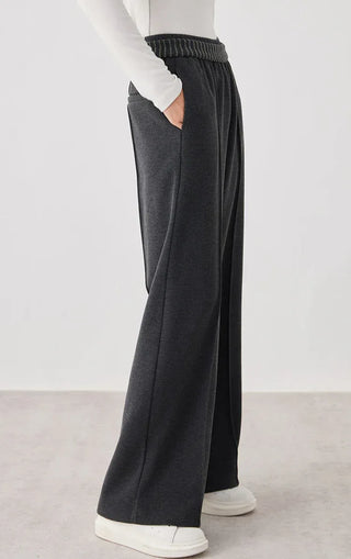 Dark gray wide-leg knit pants, side view; ribbed elastic waistband