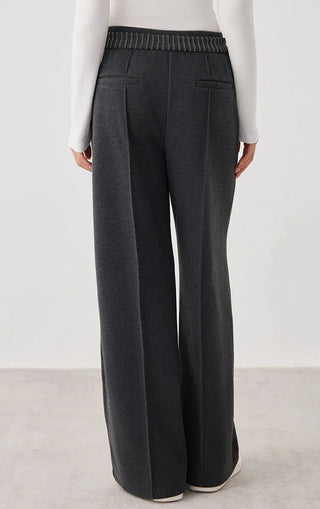Dark gray wide-leg knit pants with front seam details and elastic waistband